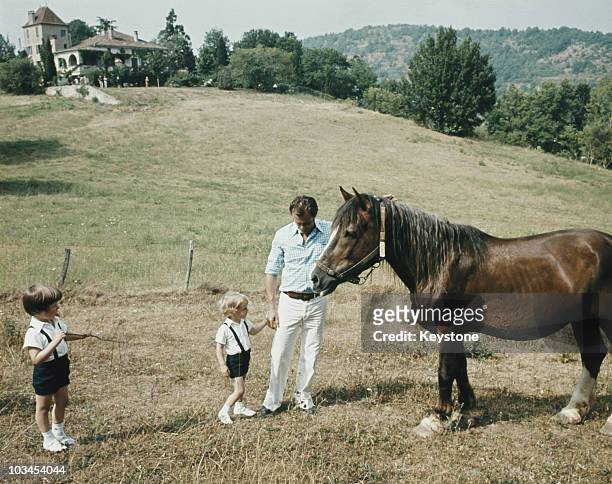 Prince Henrik of Denmark plays with his sons Princes Joachim and Frederik while on holiday at Chateau de Cayx in Cahors, Southern France in August...