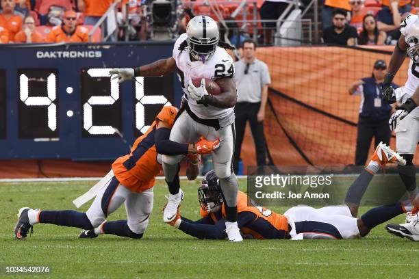Marshawn Lynch of the Oakland Raiders rushes with the ball during the fourth quarter against the Denver Broncos. The Denver Broncos hosted the...