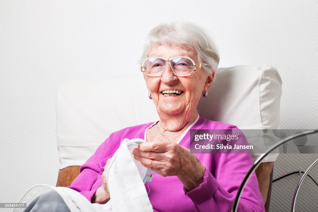 Senior woman embroidering