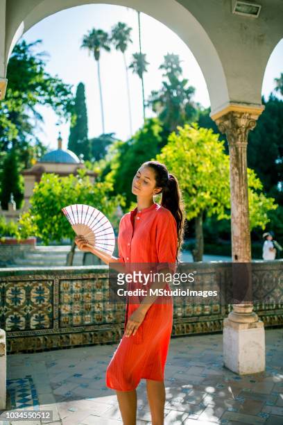 woman using hand fan. - hot spanish women stock pictures, royalty-free photos & images
