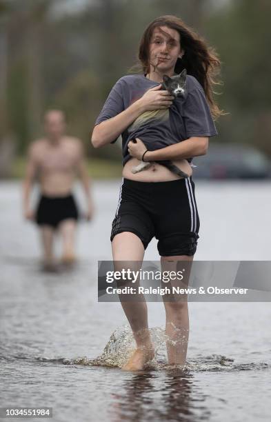 Amanda Mason on Newport, N.C. Carries a cat she rescued from her neighborhood off of Nine Foot Road on Sunday afternoon, Sept. 16, 2018. Mason and...