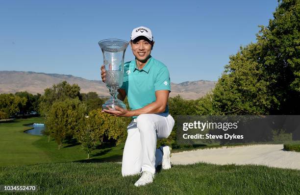 Sangmoon Bae of the Republic of Korea poses with the trophy after winning the Albertsons Boise Open at the Hillcrest Country Club on September 16,...