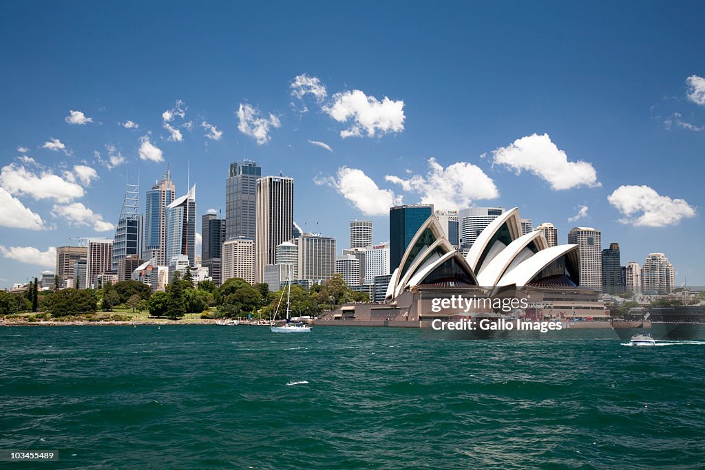 Sydney Opera House in Sydney Harbor with downtown skyline, Sydney, New South Wales, Australia