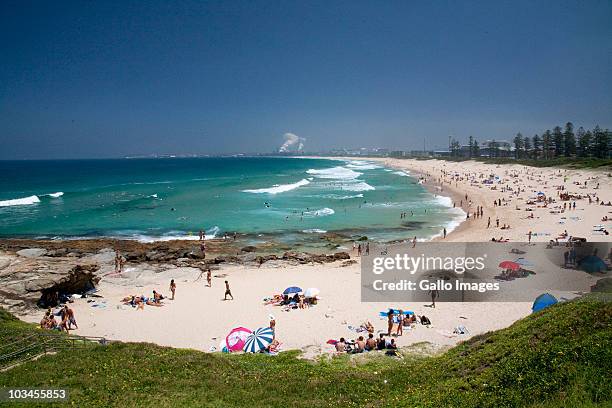 beach with port kembla industrial area in background, wollongong, new south wales, australia - wollongong stock pictures, royalty-free photos & images