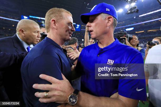 Head coach Jason Garrett of the Dallas Cowboys greets head coach Pat Shurmur of the New York Giants after the Dallas Cowboys beat the New York Giants...