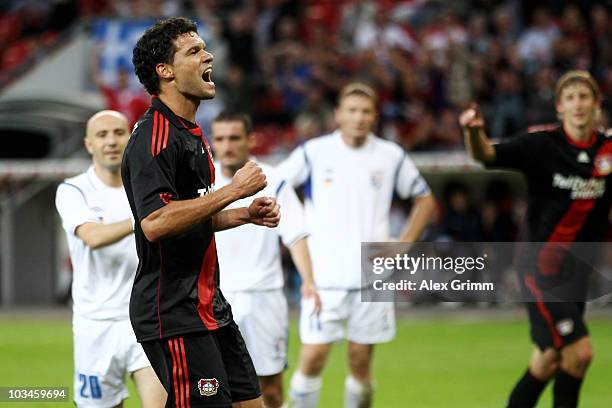 Michael Ballack of Leverkusen celebrates his team's third goal during the UEFA Europa League play-off first leg match between Bayer 04 Leverkusen and...