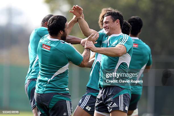 Dan Carter tustles with team mate Piri Weepu during the New Zealand All Blacks training session held at the Witswatersrand University on August 19,...