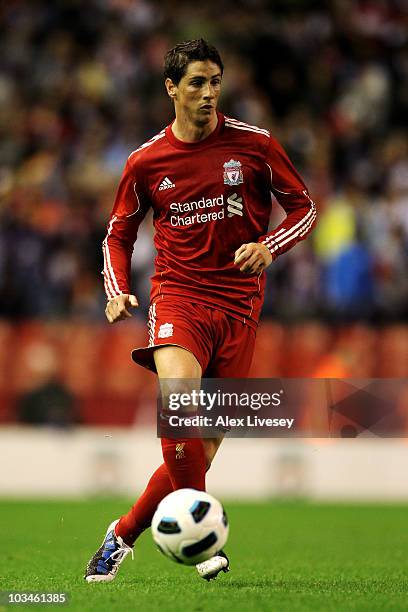 Fernando Torres of Liverpool in action during the UEFA Europa League play-off first leg match beteween Liverpool and Trabzonspor at Anfield on August...