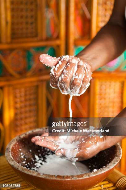 preparing coconut bath for spa treatment - fiji people stock pictures, royalty-free photos & images