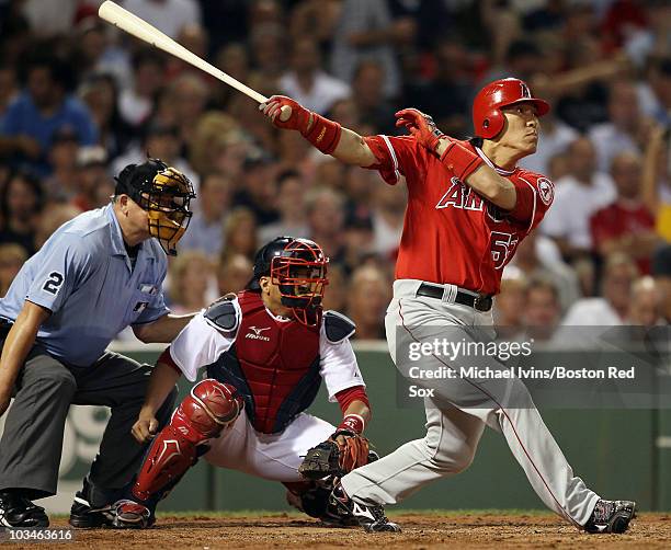 Hideki Matsui of the Los Angeles Angels of Anaheim hits a three run homer in the sixth inning as Victor Martinez of the Boston Red Sox defends on...