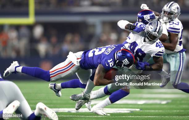 Cody Latimer of the New York Giants runs the ball against Joe Thomas of the Dallas Cowboys at AT&T Stadium on September 16, 2018 in Arlington, Texas.