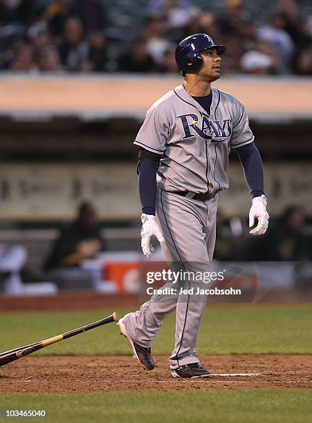 Carlos Pena of the Tampa Bay Rays hits a two run home run against the Oakland Athletics in the fourth inning during an MLB game at the...