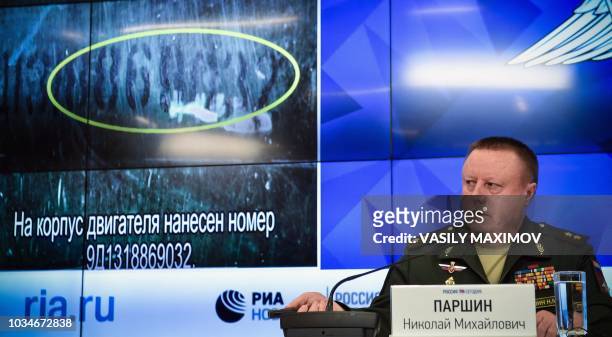 Russia's defence ministry Chief of the Main Rocket and Artillery Department Lt. Gen. Nikolai Parshin attends a press briefing dedicated to the crash...
