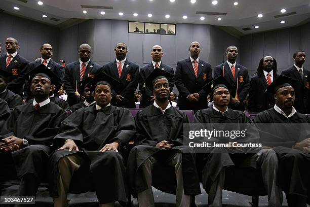 Current members of Pi Eta Kappa stand behind new Pi Eta Kappa inductee's during the induction ceremony at the 3rd Pi Eta Kappa Honor Society...