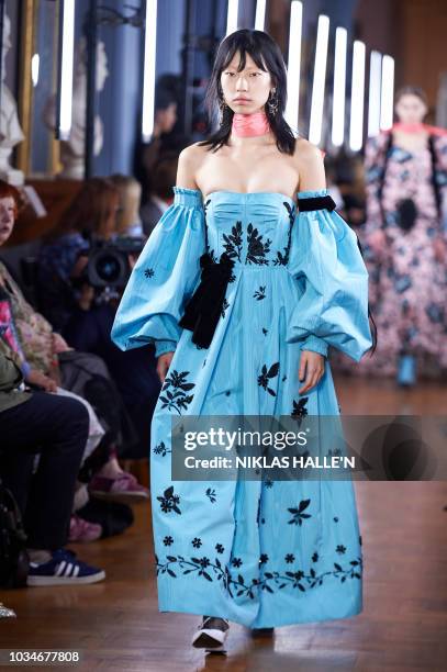 Models present creations by Erdem, during a catwalk show for the Spring/Summer 2019 collection on the fourth day of London Fashion Week in London on...