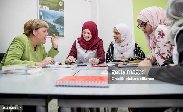 September 2018, Algeria, Algier: German Chancellor Angela Merkel speaks to German students at the Lycée Aicha Oum el Mouminine School. The Lycée...
