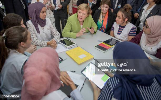 September 2018, Algeria, Algier: German Chancellor Angela Merkel speaks to German students at the Lycée Aicha Oum el Mouminine School. The Lycée...