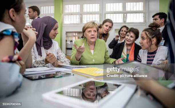 September 2018, Algeria, Algier: German Chancellor Angela Merkel speaks to German students at the Lycée Aicha Oum el Mouminine School. The Lycée...