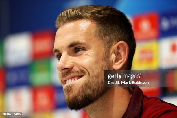 Jordan Henderson of Liverpool speaks to the media during the Liverpool press conference at Melwood Training Ground on September 17, 2018 in...