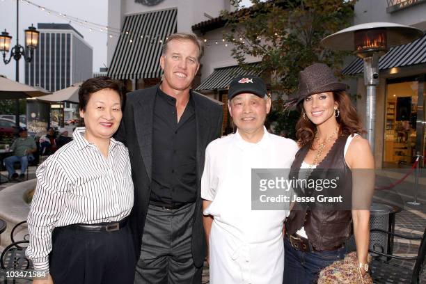 Yumiko Nozawa, former NFL quarterback John Elway, chef Nozawa and actress paige Green attend the SugarFish by Sushi Nozawa grand opening party on...