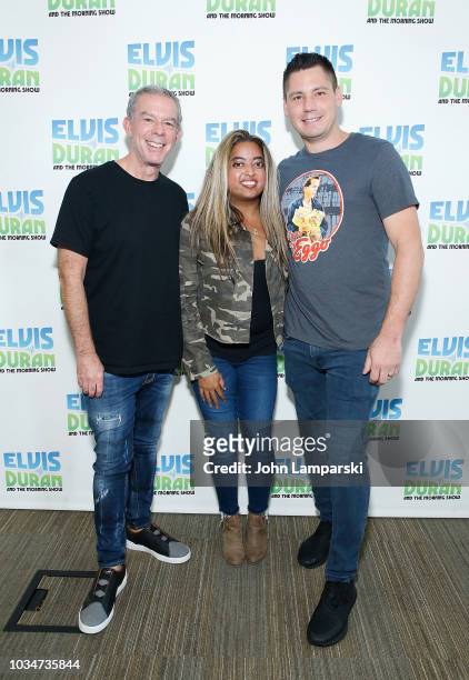 Elvis Duran and Alex Carr pose with Cohost Medha Gandh i as she joins "The Elvis Duran Z100 Morning Show" at Z100 Studio on September 17, 2018 in New...