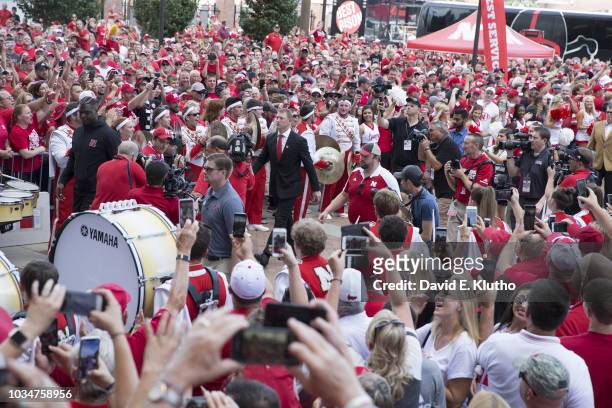 Nebraska coach Scott Frost and players walking through fans outside Memorial Stadium before game vs Akron. Lincoln, NE 9/1/2018 CREDIT: David E....