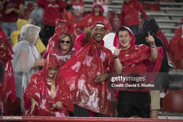 Nebraska fans in stands in the rain during game vs Akron at Memorial Stadium. Weather. Lincoln, NE 9/1/2018 CREDIT: David E. Klutho