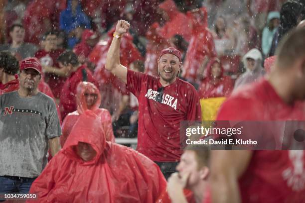 Nebraska fan in stands in the rain during game vs Akron at Memorial Stadium. Weather. Lincoln, NE 9/1/2018 CREDIT: David E. Klutho