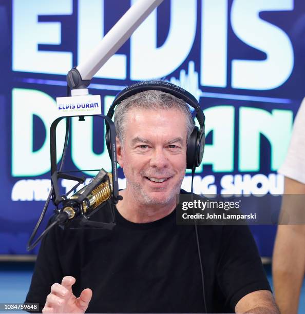 Host Elvis Duran speaks as Cohost Medha Gandhi joins "The Elvis Duran Z100 Morning Show" at Z100 Studio on September 17, 2018 in New York City.