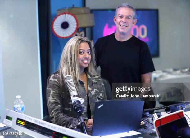 Host Elvis Duran and cohost Medha Gandhi pose as she joins "The Elvis Duran Z100 Morning Show" at Z100 Studio on September 17, 2018 in New York City.