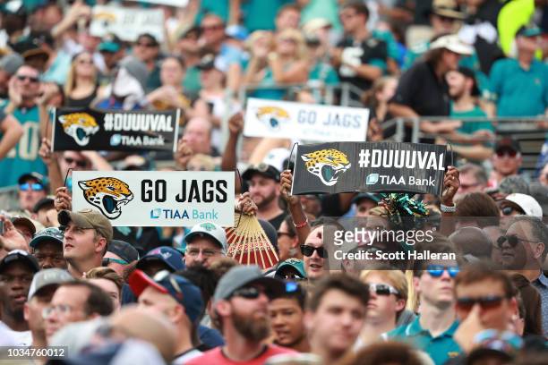 Fans wait in the stands during the second half of the game between the New England Patriots and the Jacksonville Jaguars at TIAA Bank Field on...