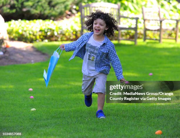 Following their Easter Sunday service "From Empty Tomb to Filled Lives", about a dozen children scramble for chocolate filled Easter eggs on the lawn...