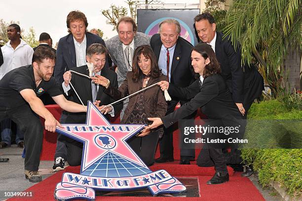 Sir Paul McCartney, Hollywood Chamber of Commerce President and CEO Leron Gubler, actor Eric Idle, Olivia Harrison, Los Angeles city councilman Tom...