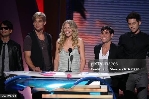Musicians Jason Rosen, Andrew Lee, Michael Bruno and Alexander Noyes of Honor Society with Jennifer Morrison speak onstage during the Teen Choice...