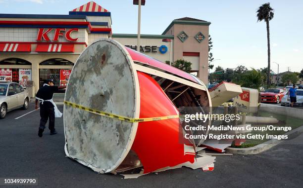 Strong winds toppled the giant bucket sign at the KFC in the 4500 block of Atlantic Avenure in Long Beach, CA on Monday, April 25, 2016. Nobody was...