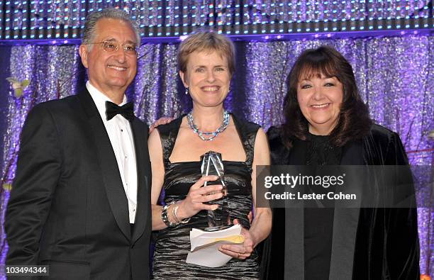 President & CEO Del Bryant and Richard Kirk Award recipient Rachel Portman and Vice President, Film/TV Relations Doreen Ringer Ross pose onstage...