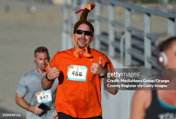 Runners take part in the 15th annual Long Beach Turkey Trot on Thursday, November 23, 2017. Justin Rudd and his Community Action Team put on the...