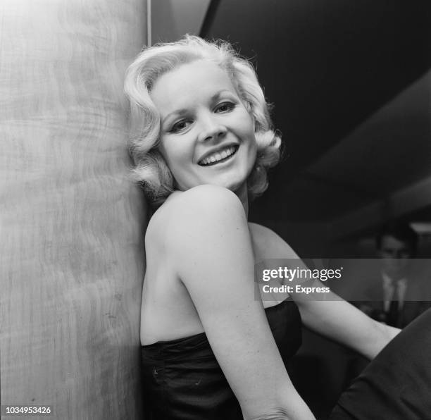 American actress Carroll Baker posed wearing a black strapless evening dress at an event in London on 9th September 1963. Carroll Baker is currently...