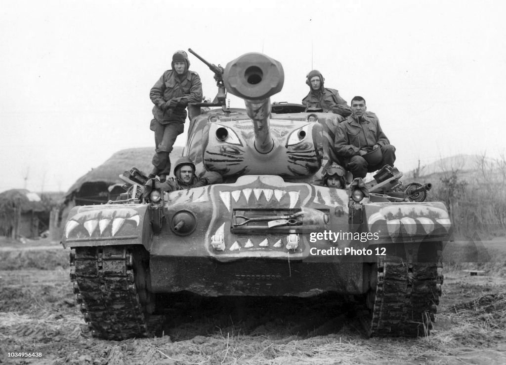 Soldiers Sat on a Painted M-46 Tank.