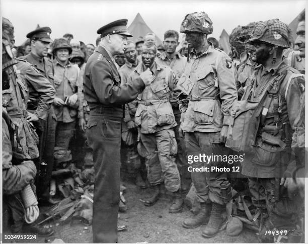General Dwight D. Eisenhower gives the order of the day, "Full victory--nothing else" to paratroopers somewhere in England, just before they board...