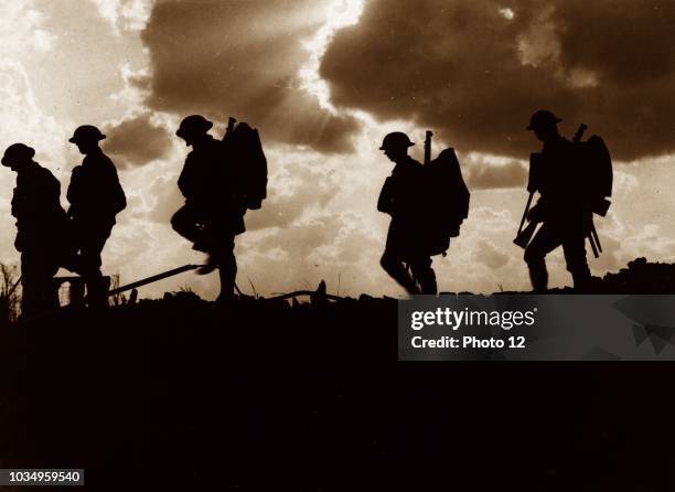 Photograph of Five Soldiers silhouetted against the sky at the Battle of Broodseinde. The Battle of Broodseinde was fought near Ypres in Flanders, at...