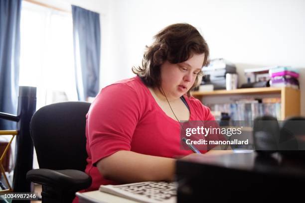 Young adult with Down syndrome on her computer