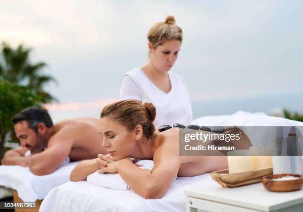 go and relax! - massage couple stock pictures, royalty-free photos & images