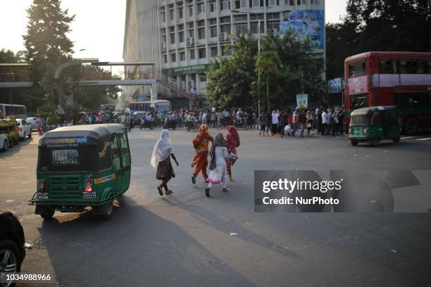 Bangladeshi girls are crossing road risky in Dhaka, Bangladesh on September on 17, 2018. Around 2500 people were killed on road accidents across the...