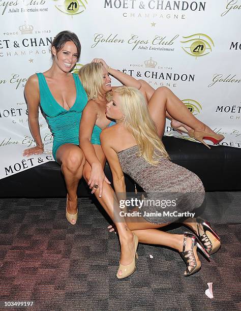 Playboy Playmates Lindsey Vuolo,Laurie Fetter and Lauren Anderson attend the grand opening of Golden Eyes on August 5, 2010 in St Maarten,...
