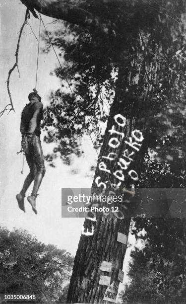 Photograph of the Lynching of Bennie Simmons, soaked in coal oil before being set on fire. Anadarko, Oklahoma. Dated 1913.