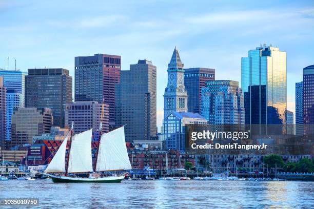 sailboat on boston harbor - boston massachusetts stock pictures, royalty-free photos & images