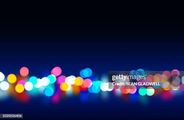 colourful bokeh lights from street lights and traffic - citylight stockfoto's en -beelden