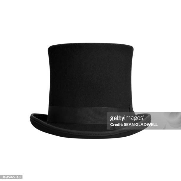 top hat on white background - black hat stock pictures, royalty-free photos & images