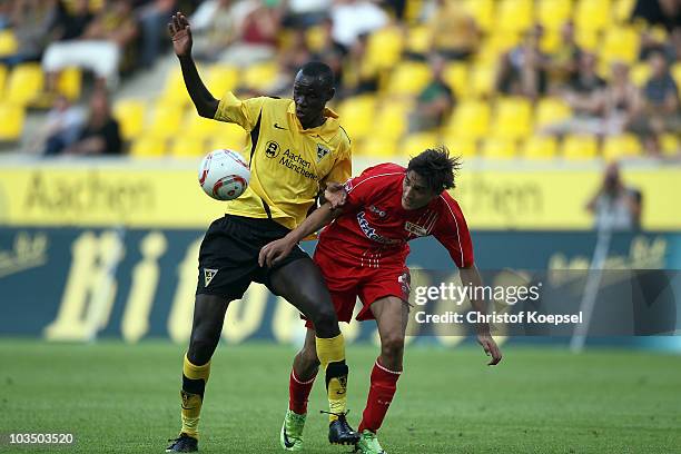 Jérome Polenz of Union Berlin challenges Babacar Gueye of Aachen during the Second Bundesliga match between Alemannia Aachen and FC Union Berlin at...